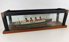 A cased model of the SS Mauritania 22in long inc.