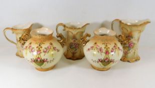 A pair of Crown Devon ovoid vases twinned with a C