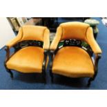 Two upholstered armchairs, one lacking wheel