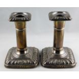 A pair of silver candlesticks I. S. Greenberg & Co