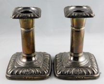 A pair of silver candlesticks I. S. Greenberg & Co