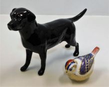 A Beswick labrador dog twinned with a Royal Crown