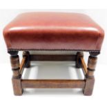 A leather topped oak footstool 15in high
