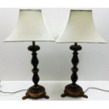 A pair of ornate wooden table lamps with shades 34