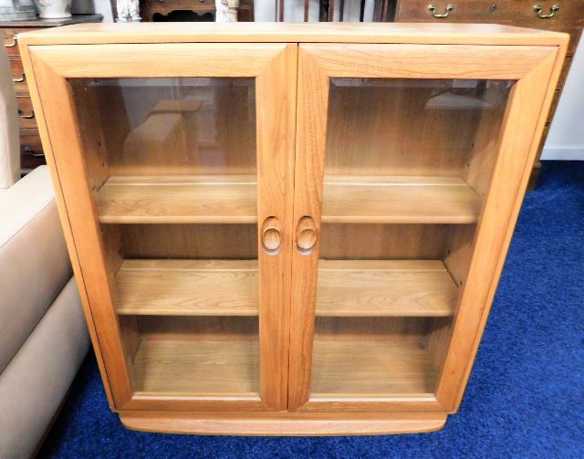 A retro Ercol elm floor standing bookcase 38in hig