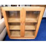 A retro Ercol elm floor standing bookcase 38in hig