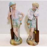 A pair of c.1900 bisque porcelain figures of boy &