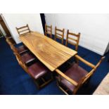 An African hardwood refectory style table top on t