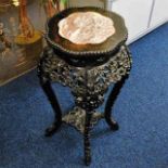 A c.1900 carved Chinese hardwood pedestal table wi