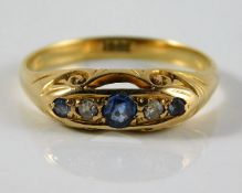 An antique 18ct gold ring set with diamond & sapph