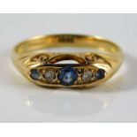 An antique 18ct gold ring set with diamond & sapph