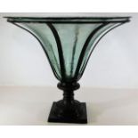 A decorative glass bowl mounted on bronze style st