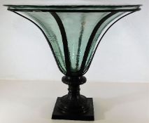 A decorative glass bowl mounted on bronze style st