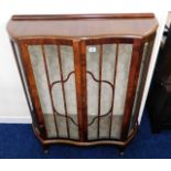 A serpentine fronted display cabinet, some faults
