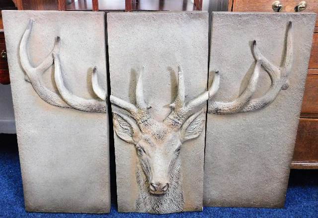 A large decorative metal triptych of stag head 41.