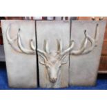 A large decorative metal triptych of stag head 41.