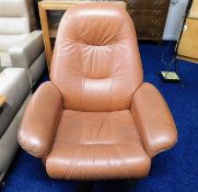 A retro Danish leather swivel armchair