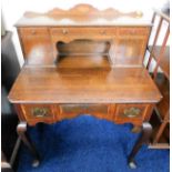 A brass fitted George III oak ladies lowboy with l