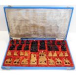 A mid 20thC. carved Chinese chess set