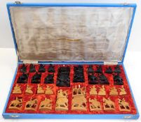 A mid 20thC. carved Chinese chess set