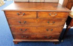 An oak George III chest of drawers with brass fitt