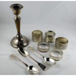 Three silver spoons twinned with five silver napki