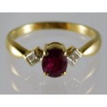 An 18ct gold ring set with ruby & diamond 2.9g siz