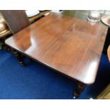 A Victorian extending mahogany dining table with l