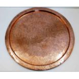 A large 19thC. copper tray of Islamic interest 23i