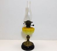 A Victorian oil lamp with glass opaline well 23.5i