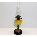 A Victorian oil lamp with glass opaline well 23.5i