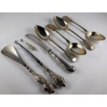Four silver teaspoons, a small silver button hook,