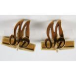 A pair of 9ct gold cufflinks letter M or W 6.9g