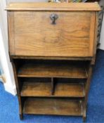 An early 20thC. slimline oak bureau bookcase