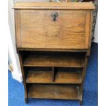 An early 20thC. slimline oak bureau bookcase