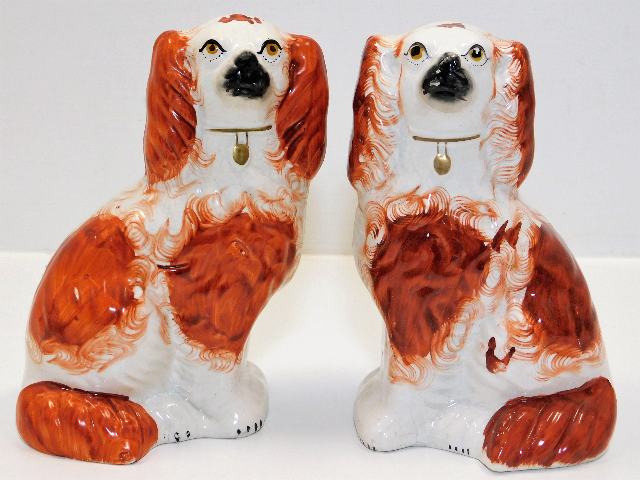 A pair of Staffordshire pottery mantle dogs 8in ta