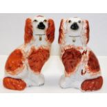 A pair of Staffordshire pottery mantle dogs 8in ta