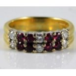 An 18ct diamond & ruby ring set with approx. 0.24ct diamond 5.4g size L/M