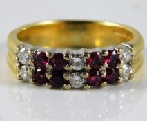 An 18ct diamond & ruby ring set with approx. 0.24ct diamond 5.4g size L/M