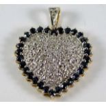 A 9ct gold pendant set with diamond & sapphire 3g