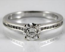 An 18ct white gold ring set with approx. 0.55ct ce