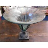 A decorative centrepiece with glass bowl set withi