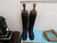 A pair of leather boots with trees