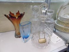 Three decanters, one art glass vase & one other