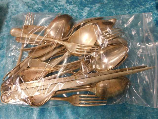 A bagged quantity of silver plated flatwares inclu