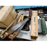 Two carpenters saws, a large axe & other tools inc