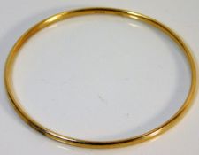 A 9ct gold bangle 11.6g