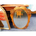 An oak mounted oval mirror