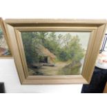 A c.1900 gilt framed oil painting depicting boatho