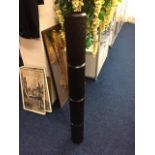 A decorative "didgeridoo" style wooden object 48in